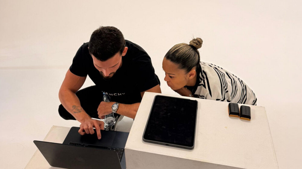 Eri Krasniqi And Scarlett Abrahams, HikersIsland looking at a laptop